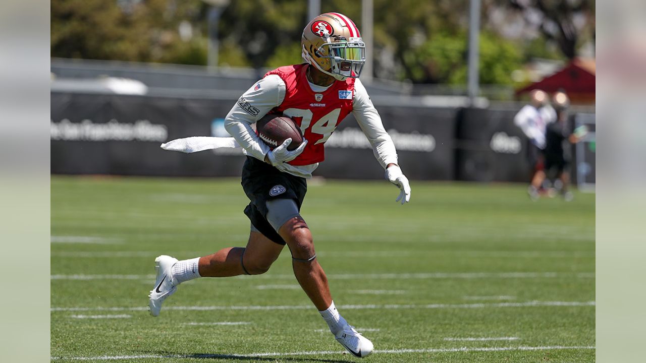 San Francisco 49ers' Jayson DiManche, left, grabs the jersey of Reuben  Foster during practice at an NFL football training camp in Santa Clara,  Calif., Saturday, Aug. 5, 2017. (AP Photo/Jeff Chiu Stock