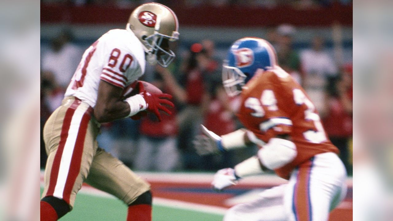 28 Jan 1990: Quarterback Joe Montana of the San Francisco 49ers throws  while pressured during the 49ers 55-10 victory over the Denver Broncos in Super  Bowl XXIV at the Louisiana Superdome in