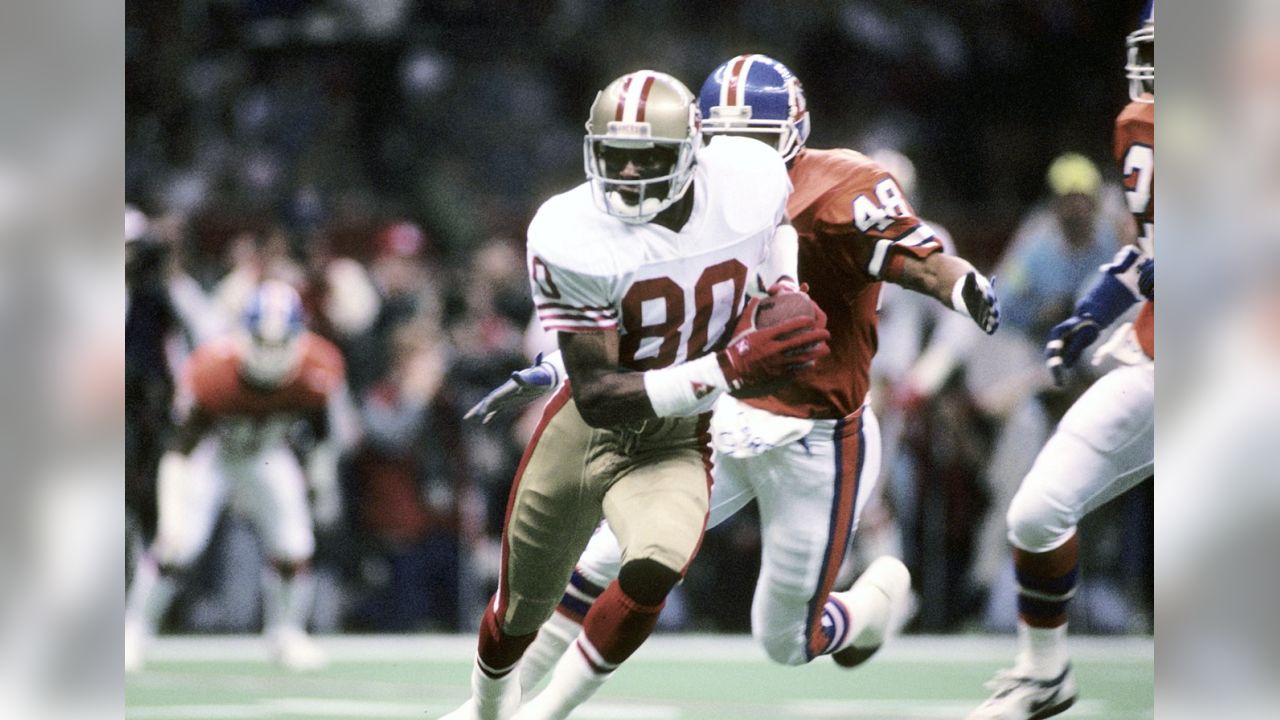 Joe Montana #16 of the San Francisco 49ers sets up to pass against the  Denver Broncos in Super Bowl XXIV at the Superdome NEW ORLEANS, LA -  JANUARY 28 Photo Print - Item # VARPFSAAKS035 - Posterazzi