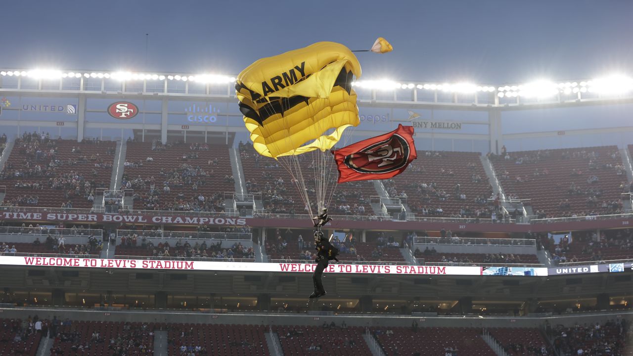 The Golden Knights parachute into the Levis Stadium before the