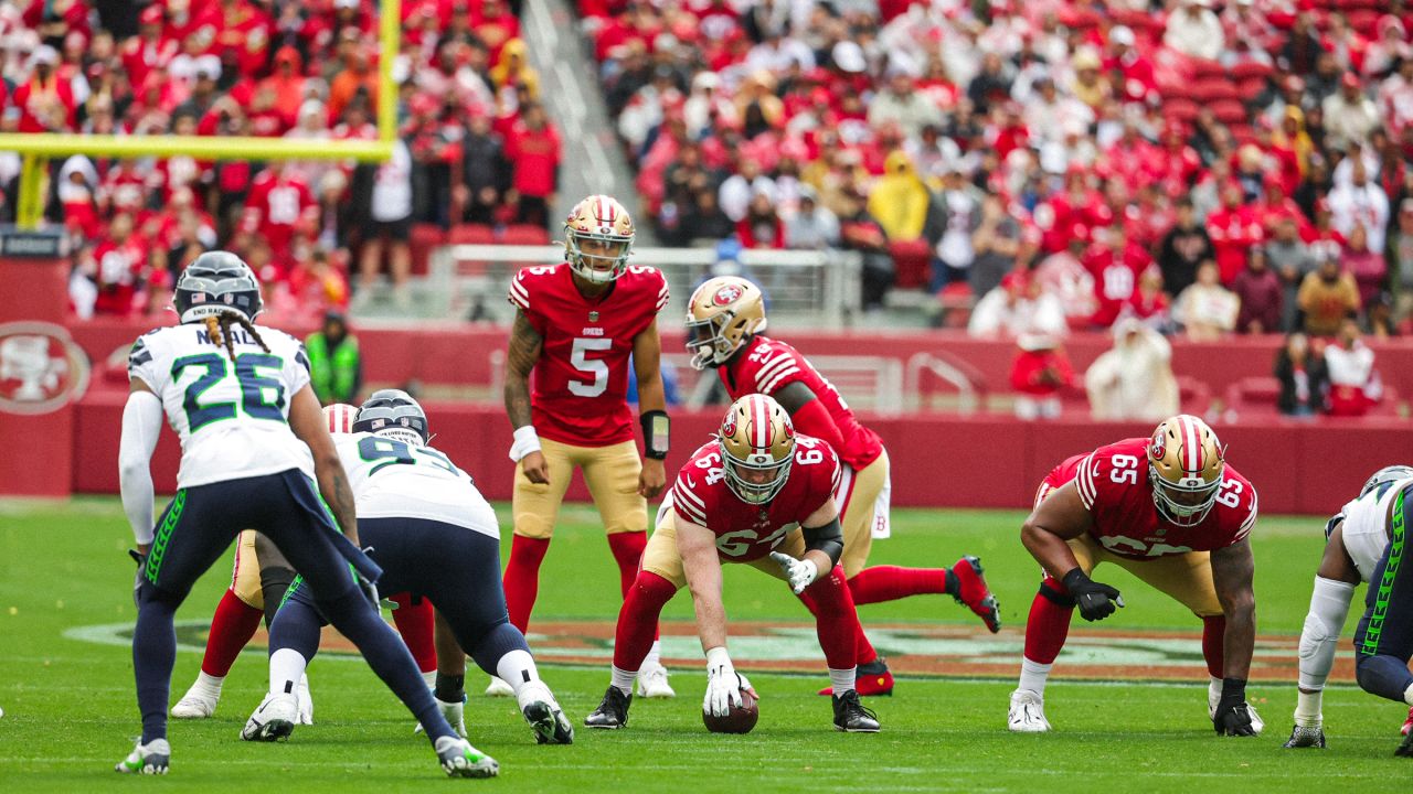 San Francisco 49ers vs. Seattle Seahawks. Fans support on NFL Game.  Silhouette of supporters, big screen with two rivals in background Stock  Photo - Alamy