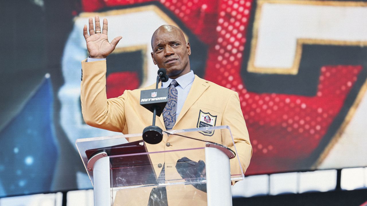 Former NFL player Bryant Young poses with his bust during an induction  ceremony at the Pro Football Hall of Fame in Canton, Ohio, Saturday, Aug.  6, 2022. (AP Photo/David Dermer Stock Photo 