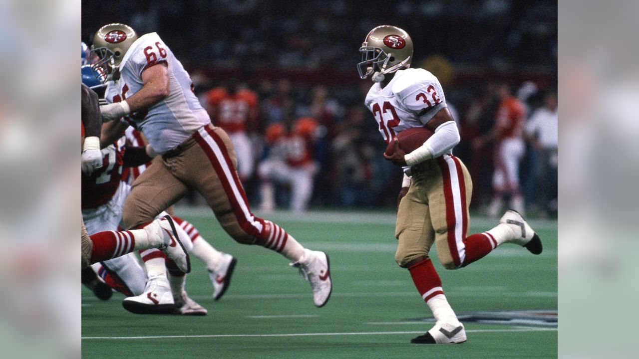 28 Jan 1990: Quarterback Joe Montana of the San Francisco 49ers throws  while pressured during the 49ers 55-10 victory over the Denver Broncos in Super  Bowl XXIV at the Louisiana Superdome in