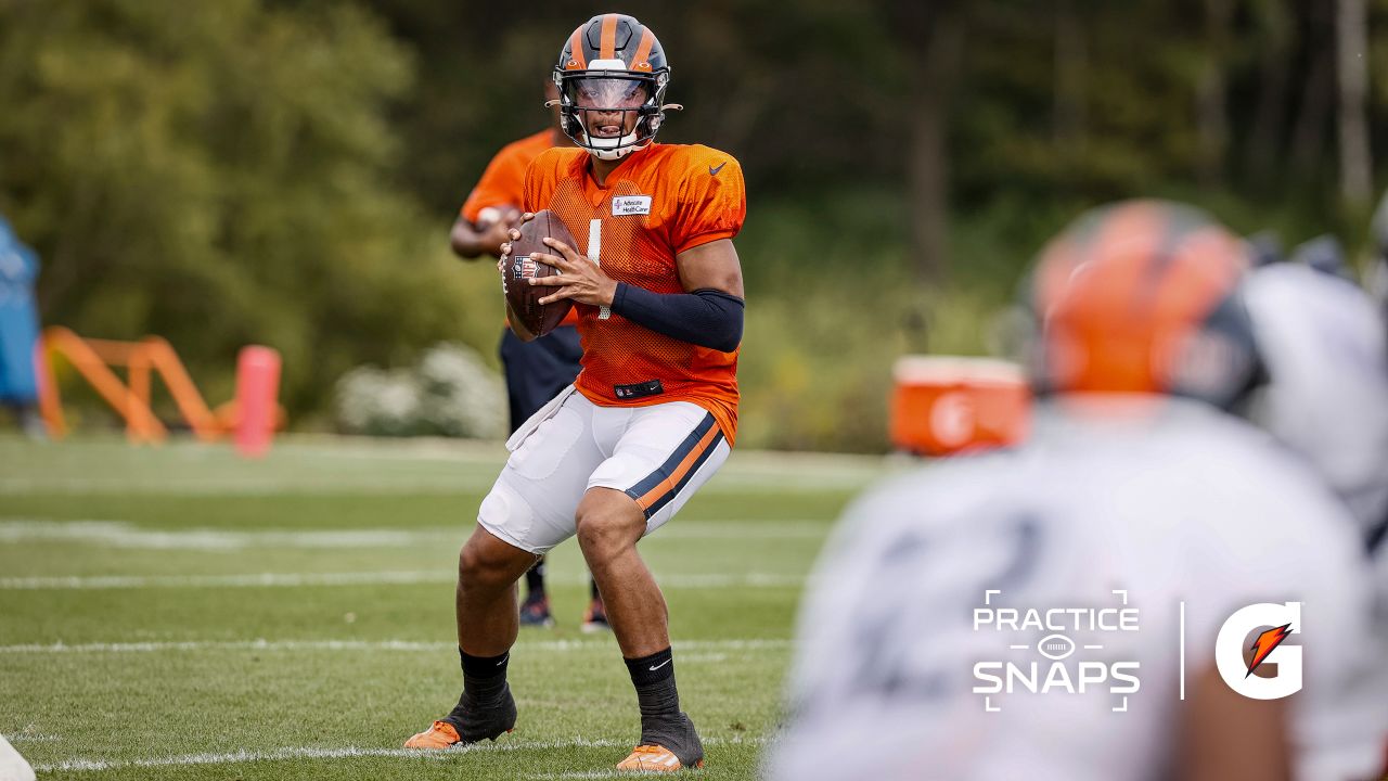 Justin Fields Chicago Bears Unsigned Throwing in Orange Alternate Uniform Photograph