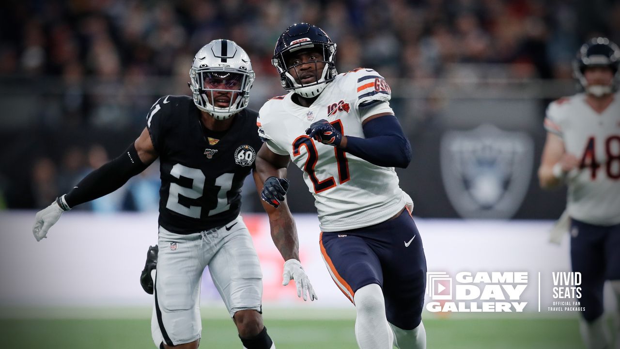 Oakland Raiders running back Josh Jacobs (28) breaks a tackle and goes in  for a touchdown during the first half of an NFL football game against the  Chicago Bears at Tottenham Hotspur