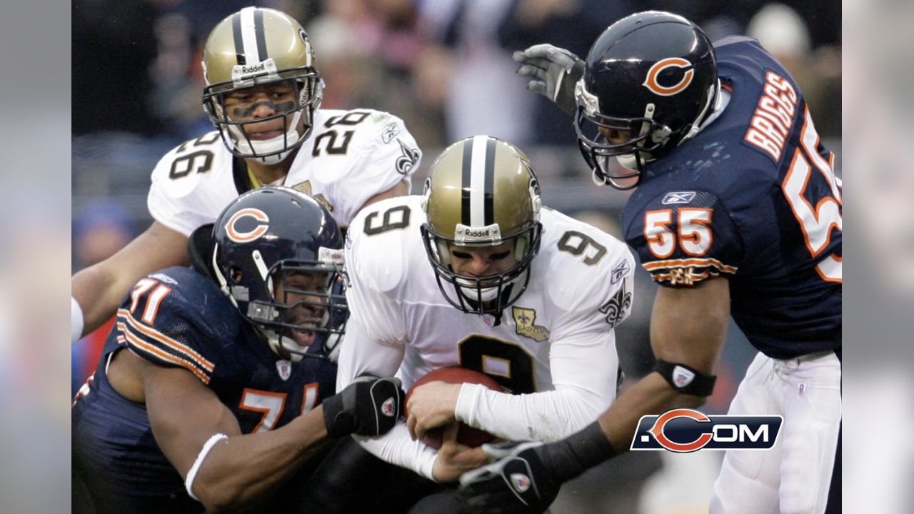 Chicago Bears' Brian Urlacher (54) holds up the NFC Championship Trophy  after the Bears beat the New Orleans Saints 39-14 in the NFC Championship  game at Soldier Field in Chicago on January