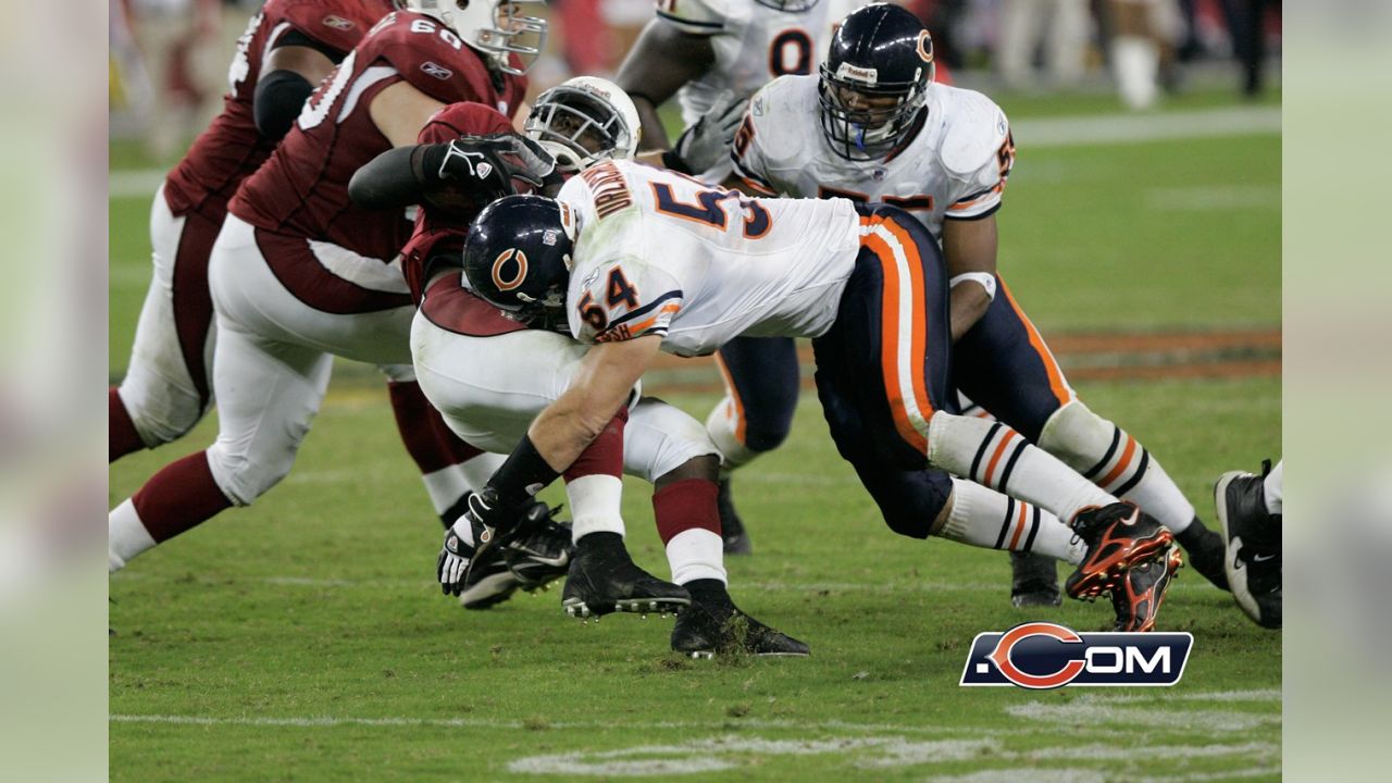 Brian Urlacher of the Chicago Bears warms up prior turnover