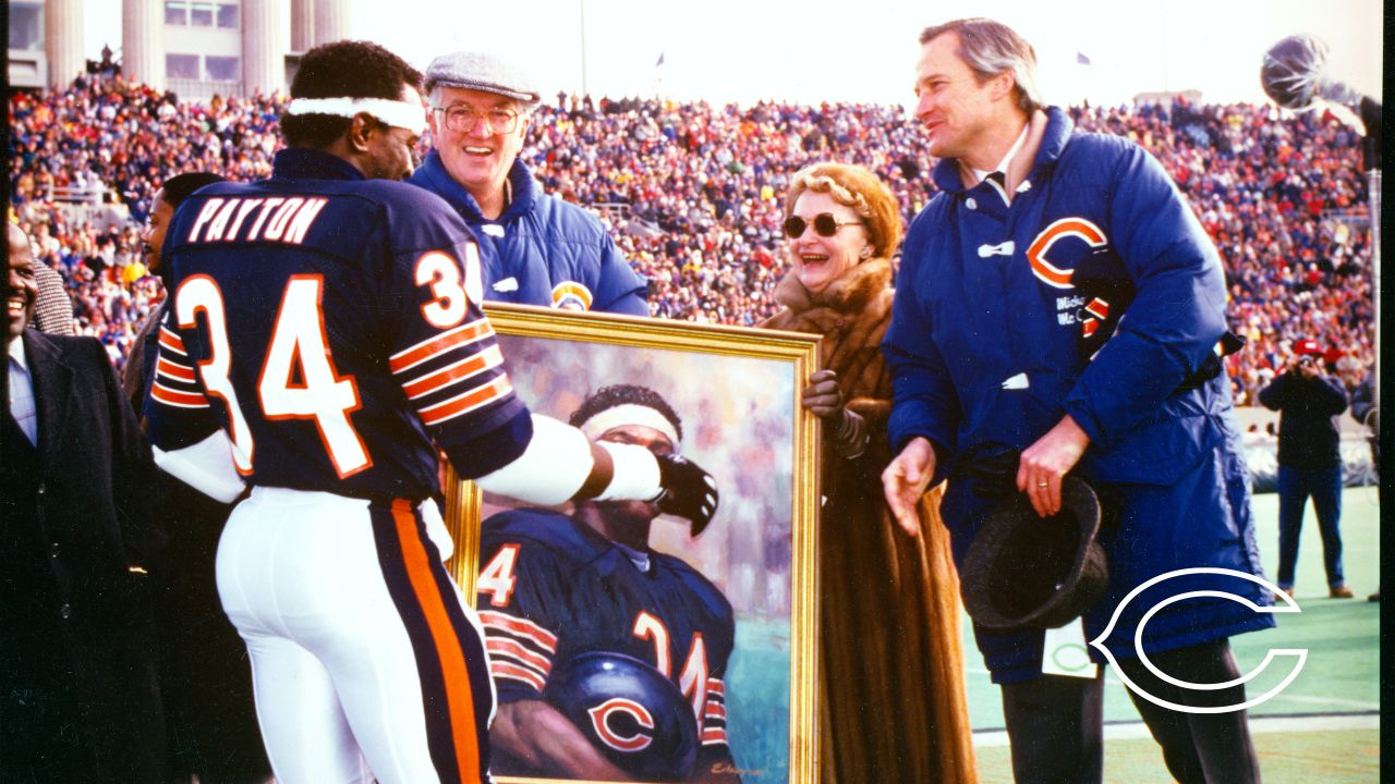 Chicago Bears chairman Michael McCaskey, left, and owner Virginia McCaskey  , center, react as they are presented with the George Halas Trophy after  the Bears beat the New Orleans Saints, 39-14, to