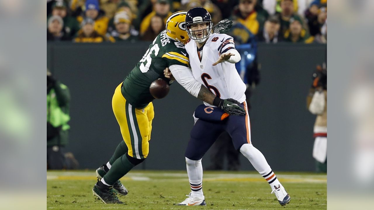 Green Bay Packers defensive tackle Jordan Miller (L) sacks Chicago Bears  quarterback Jay Cutler for a 5-yard loss during the third quarter at  Soldier Field on December 16, 2012 in Chicago. The