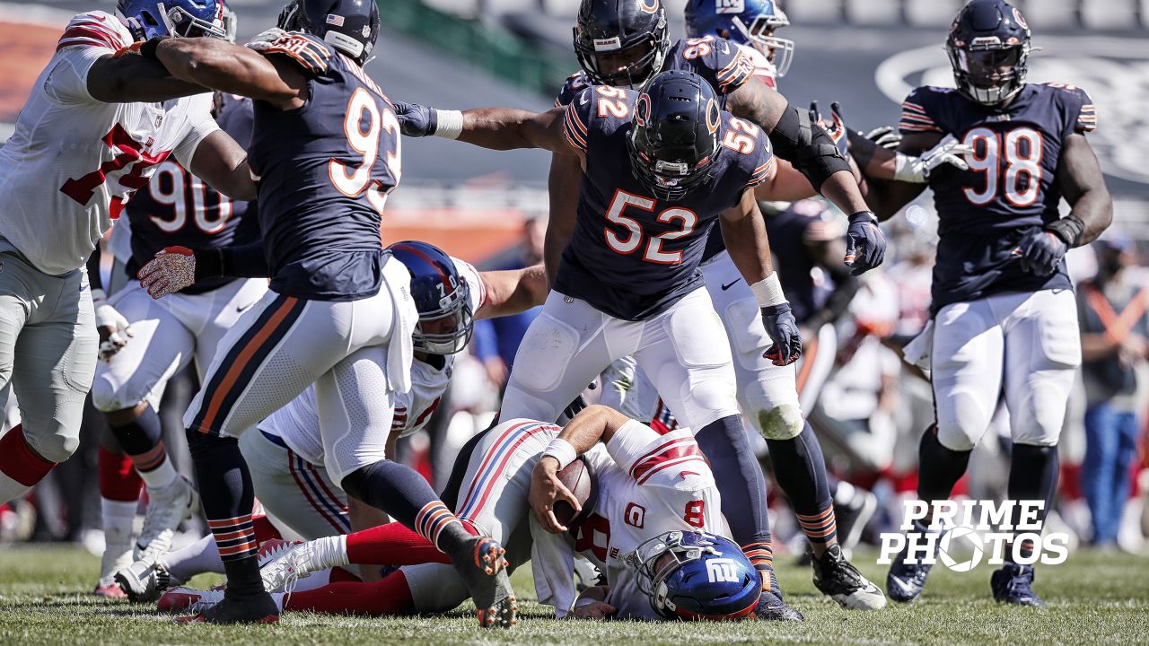 Chicago Bears outside linebacker Robert Quinn strips the ball from