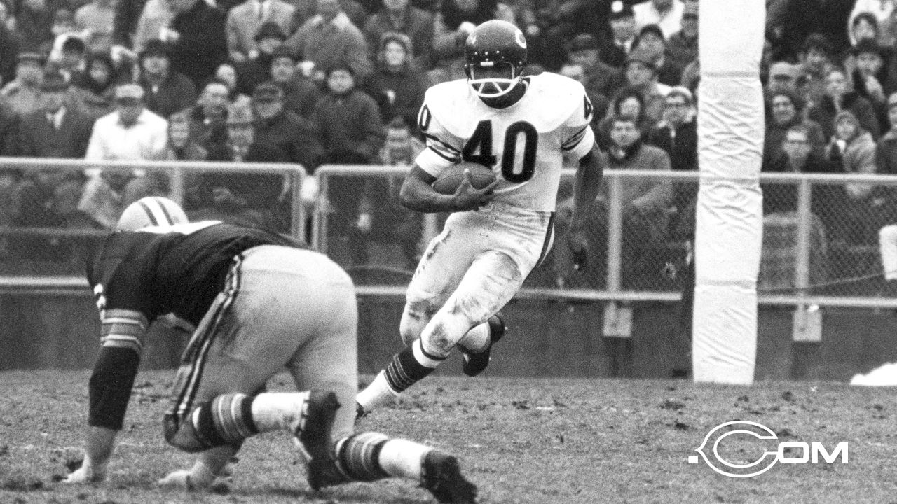 Gale Sayers, sensational halfback of the Chicago Bears, sharpens his eye  while playing pool in his basement recreation room in Chicago, Ill., Nov.  29, 1966. Sayers was named NFL Back of the