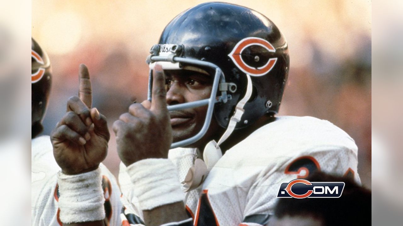 Former Chicago Bears running back Walter Payton, left, greets his