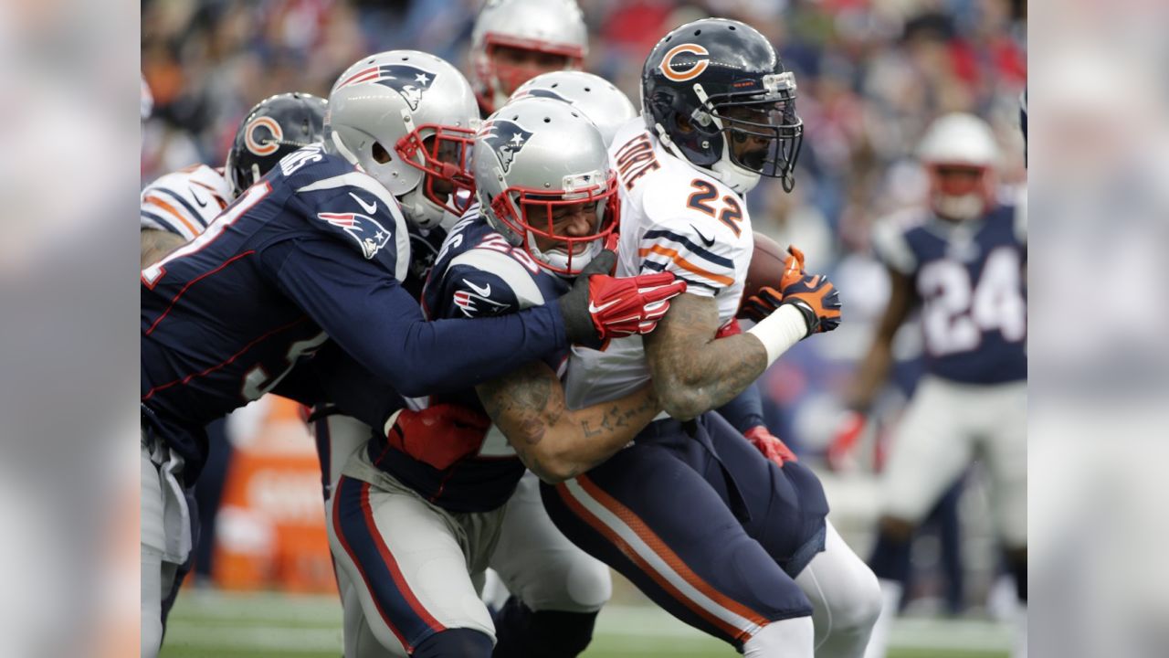 New England Patriots quarterback Tom Brady (12) passes over Chicago Bears  defensive end Lamarr Houston (99) in the first half of an NFL football game  on Sunday, Oct. 26, 2014, in Foxborough