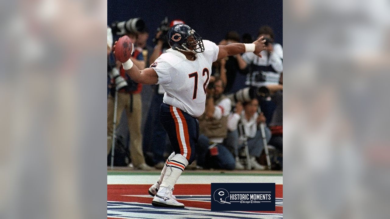 Chicago Bears' Richard Dent carries the Super Bowl Trophy as the 1985  Bears' championship team is honored duing half time of an NFL football game  between the Chicago Bears and the Washington