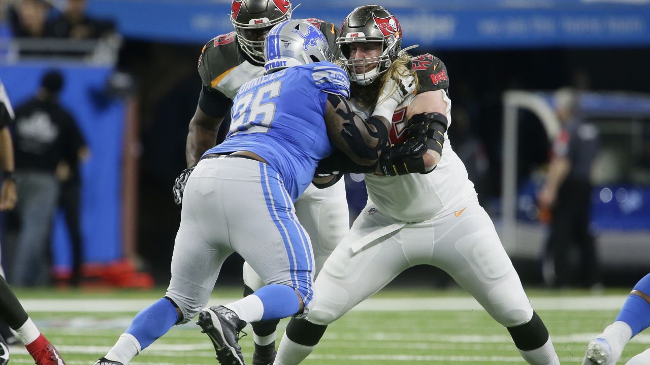 Tampa Bay Buccaneers offensive guard Alex Cappa (65) sits on the bench  during the first half of an NFL football game against the Dallas Cowboys,  Thursday, Sept. 9, 2021, in Tampa, Fla. (