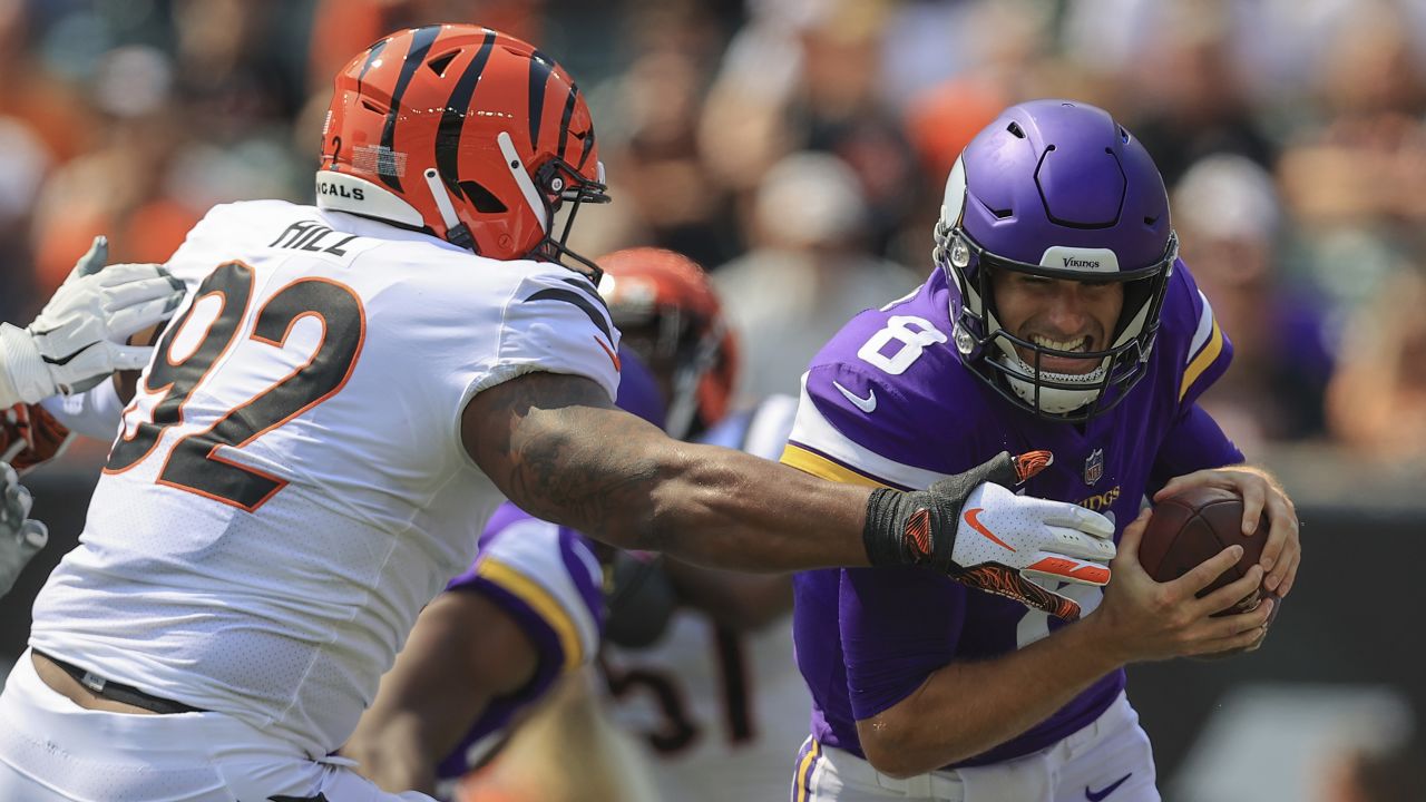 Team captains gather at center field for the coin flip before an NFL  football game between the Cincinnati Bengals and the Minnesota Vikings,  Sunday, Sept. 12, 2021, in Cincinnati. (AP Photo/Keith Srakocic