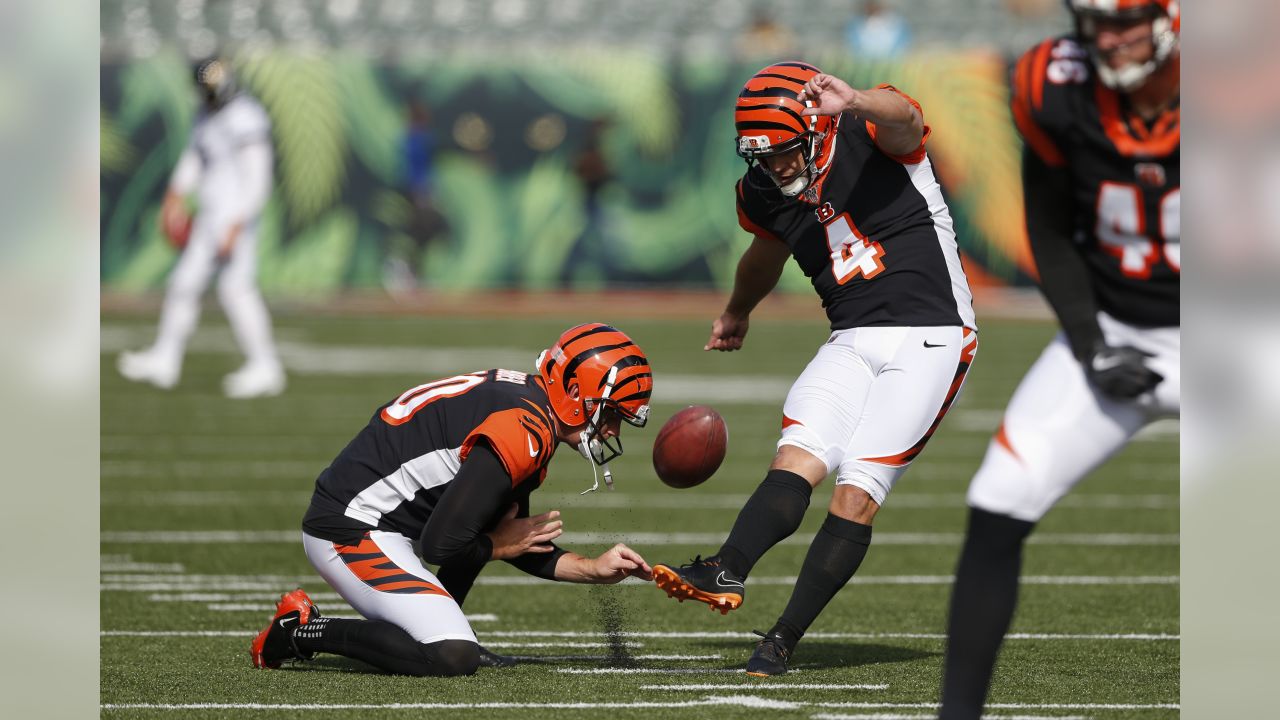 FILE - Cincinnati Bengals' Joe Mixon (28) and Orlando Brown Jr. (75) walk  onto the field during practice at the team's NFL football training  facility, Tuesday, June 6, 2023, in Cincinnati. The