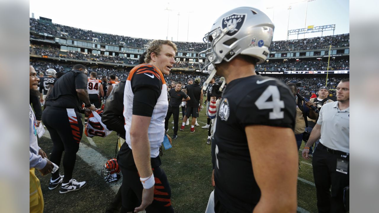 The Cincinnati Bengals look on as Bengals wide receiver Auden Tate is  carried off the field aft …