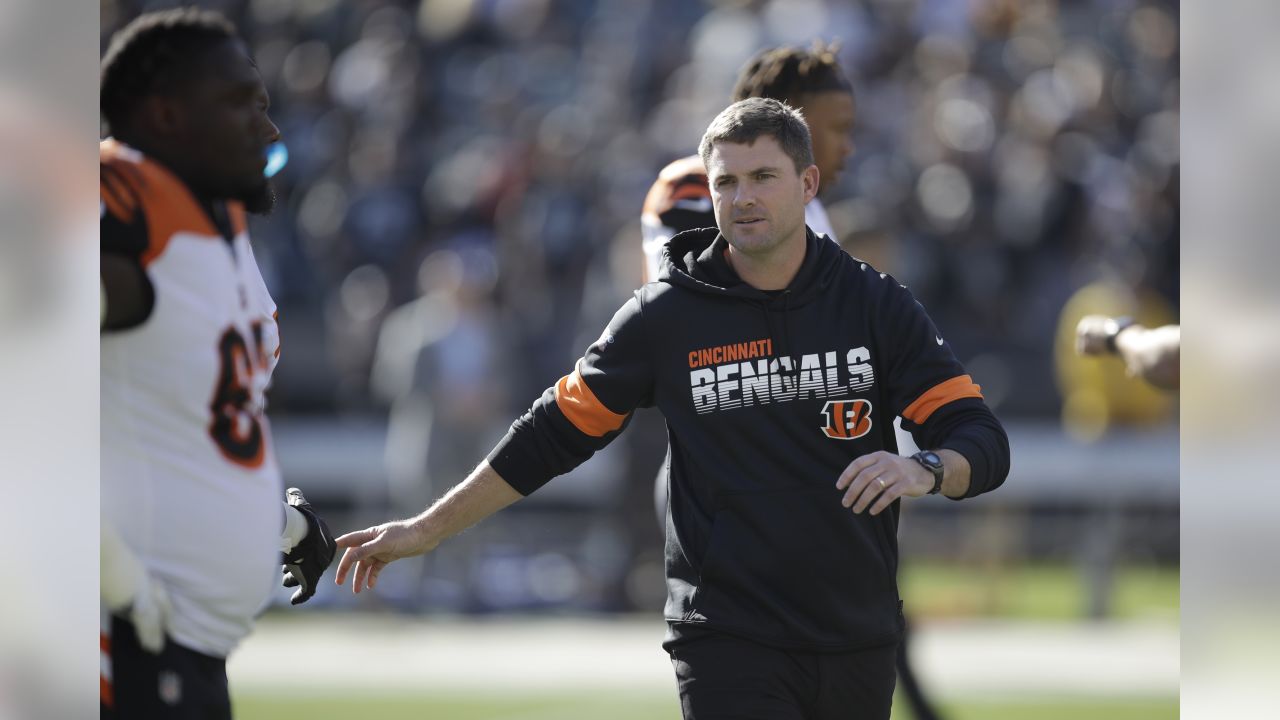 The Cincinnati Bengals look on as Bengals wide receiver Auden Tate is  carried off the field aft …