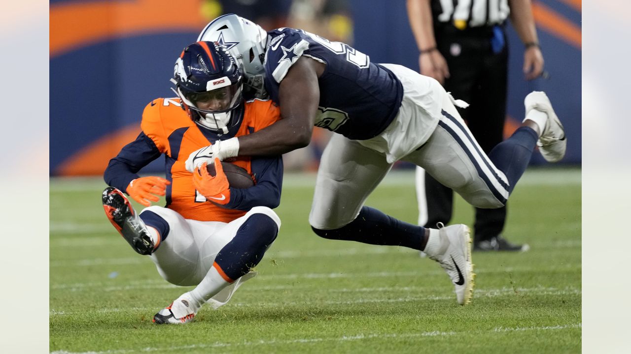 Tarell Basham of the Tennessee Titans defends against the Dallas