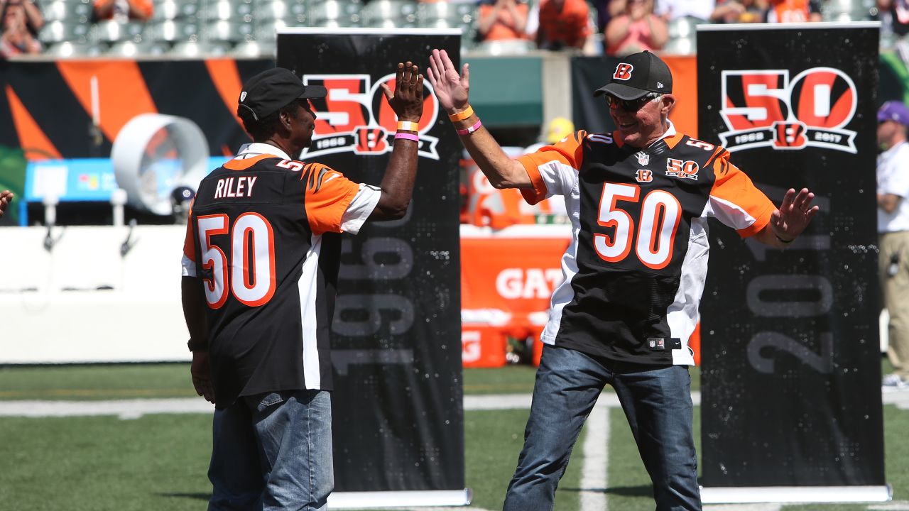 Cincinnati Bengals quarterback Ken Anderson (14) smiles as he congratulates  Cleveland Browns' quarterback Brian Sipe (17)