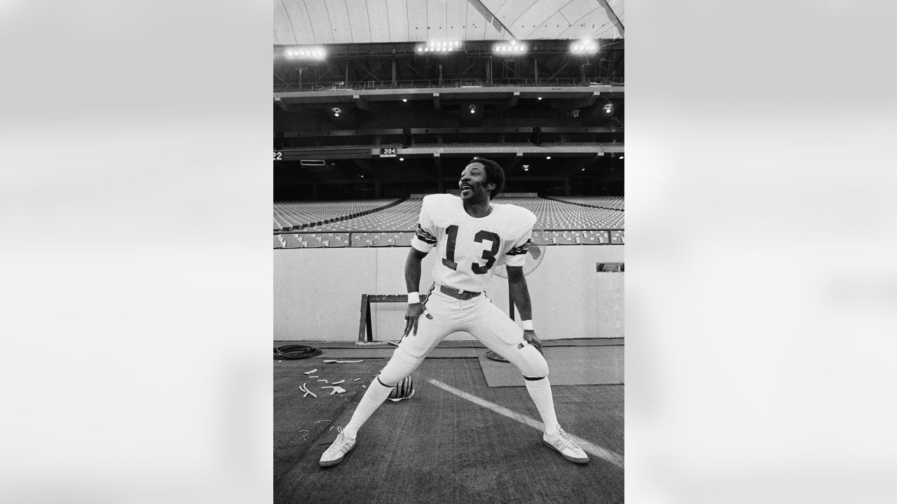 Houston Oilers wide receiver Ken Burrough (00) does a spread flip over  Cincinnati Bengals' Ken Riley (13) in the first quarter of the NFL game at  Houston on Sunday, Dec. 18, 1977.