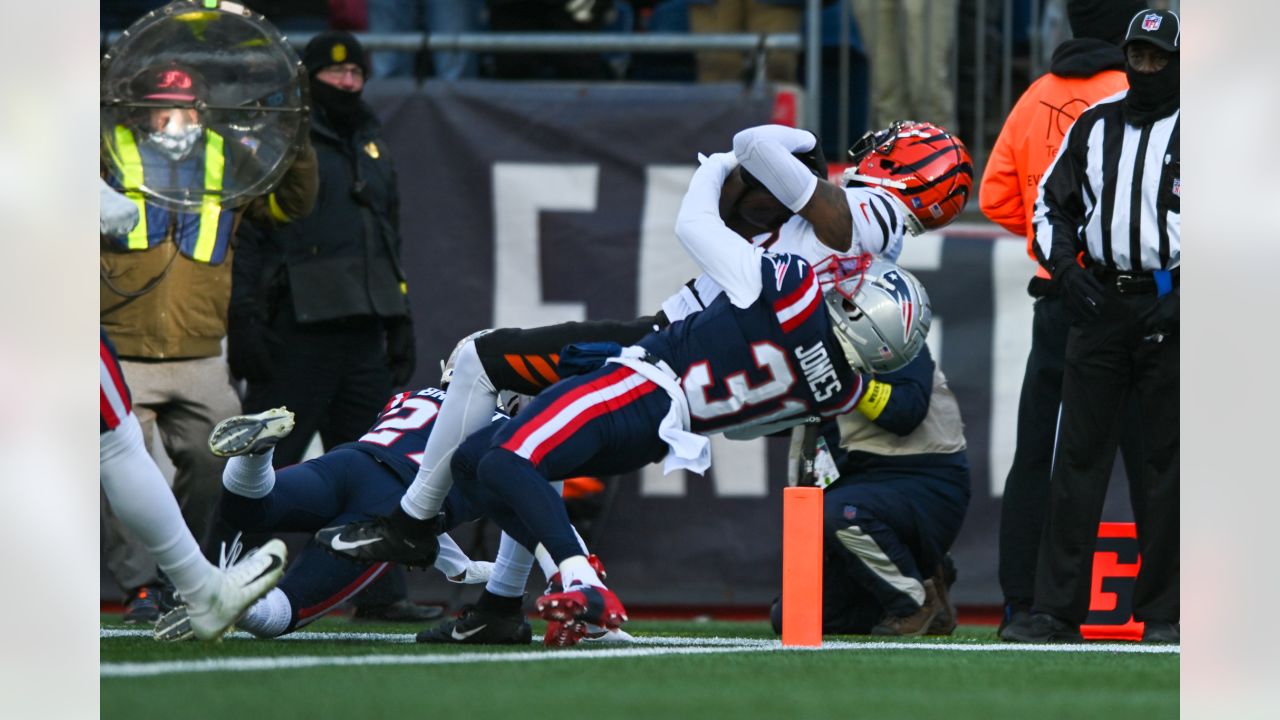 Foxborough, United States. 24th Dec, 2022. Cincinnati Bengals wide receiver  Tee Higgins (85) is lifted by New England Patriots safety Jabrill Peppers  (3) during the first half of a game at Gillette