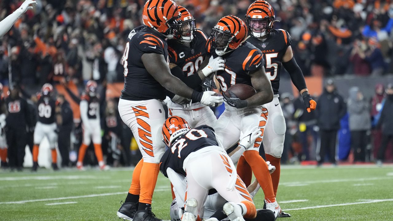 Las Vegas Raiders' Zay Jones (7) is tackled by Cincinnati Bengals' Chidobe  Awuzie (22) during the first half of an NFL wild-card playoff football  game, Saturday, Jan. 15, 2022, in Cincinnati. (AP