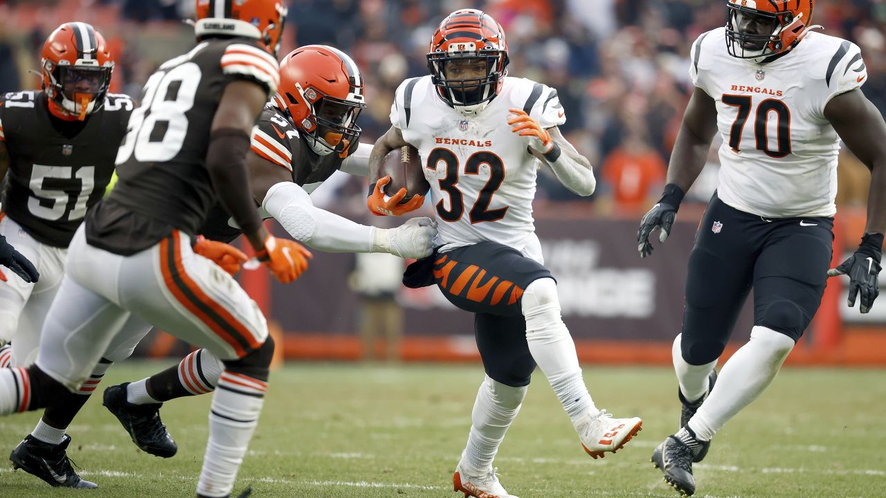 Baltimore Ravens quarterback Lamar Jackson (8) runs the ball and hurdles Carolina  Panthers cornerback CJ Henderson during the first half of an NFL football  game, Sunday, Nov. 20, 2022, in Baltimore. (AP