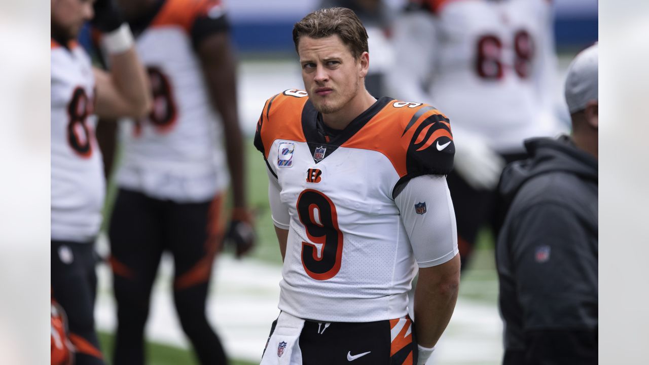 Cincinnati Bengals quarterback Joe Burrow (9) walks to the sidelines during  an NFL football gam …