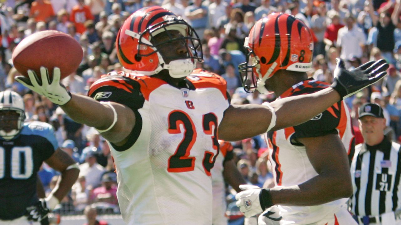 Cincinnati Bengals running back Corey Dillon (28) runs downfield with  linebacker Takeo Spikes, left, in pursuit, Wednesday, Aug. 1, 2001, at  training camp in Georgetown, Ky. Dillon is only expected to play