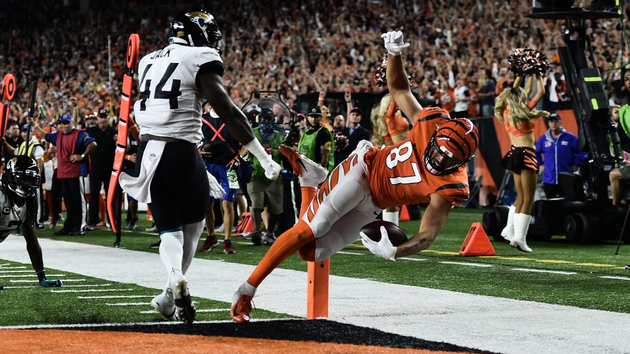 Bengals' Zac Taylor, Kevin Huber and C.J. Uzomah hand out game