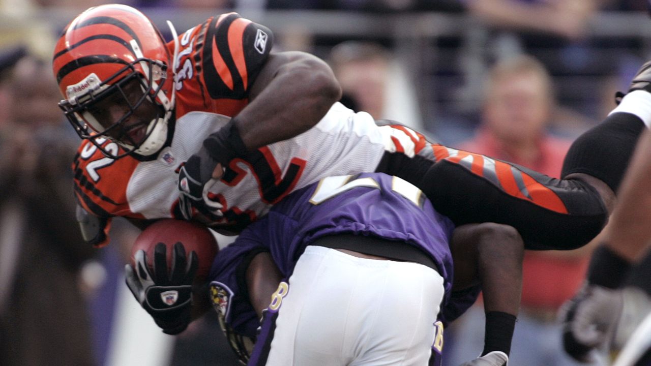 Cincinnati Bengals running back Rudi Johnson runs against the Tennessee  Titans in Cincinnati, Ohio, Aug. 23, 2003. With a record-setting game, the  low-profile running back emerged as one of the Bengals' most