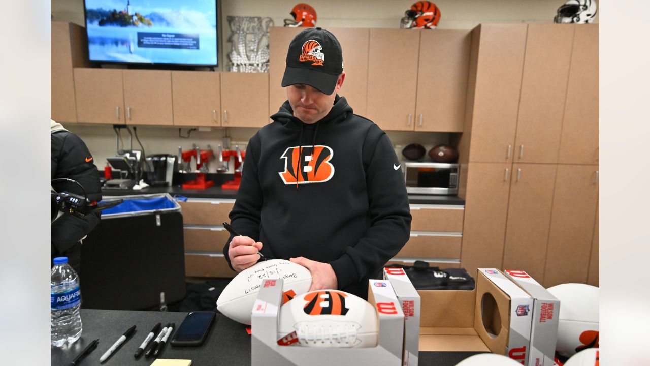 Bengals head coach presents game ball to local bars