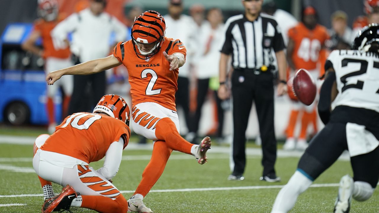 Jacksonville Jaguars' James Robinson (25) is tackled by Cincinnati Bengals'  Vonn Bell (24) during the first half of an NFL football game, Thursday,  Sept. 30, 2021, in Cincinnati. (AP Photo/Michael Conroy Stock Photo - Alamy