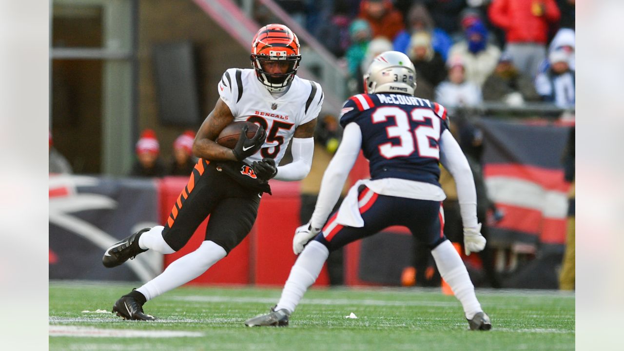 Foxborough, United States. 24th Dec, 2022. Cincinnati Bengals wide receiver  Tee Higgins (85) is lifted by New England Patriots safety Jabrill Peppers  (3) during the first half of a game at Gillette