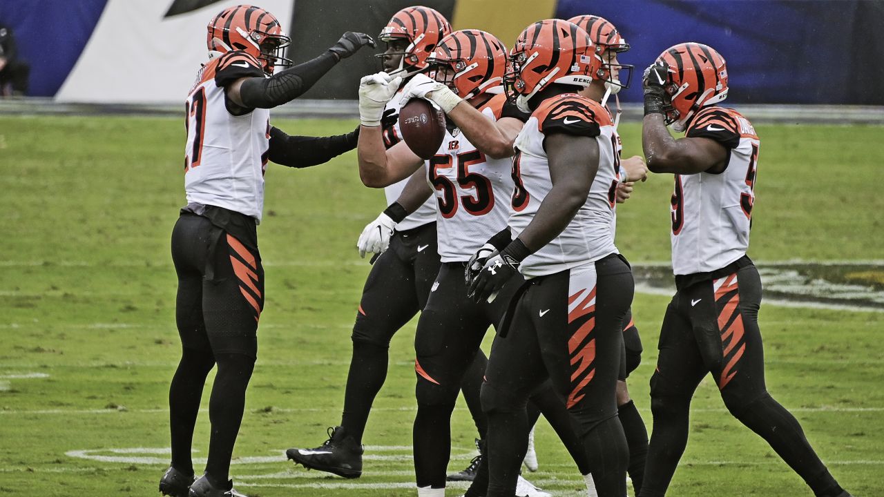 Cincinnati Bengals linebacker Logan Wilson (55) hits Philadelphia Eagles  quarterback Carson Wentz (11) as he was