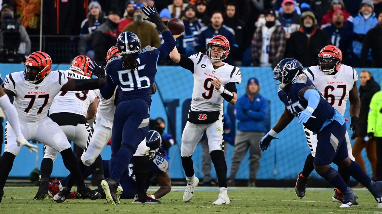 Cincinnati Bengals linebacker Logan Wilson (55) and Cincinnati Bengals  guard Hakeem Adeniji (77 …