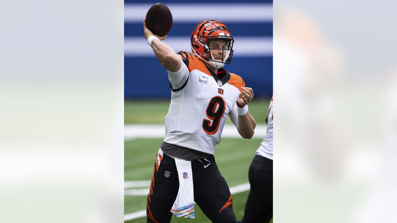 Cincinnati Bengals quarterback Joe Burrow (9) walks to the sidelines during  an NFL football gam …