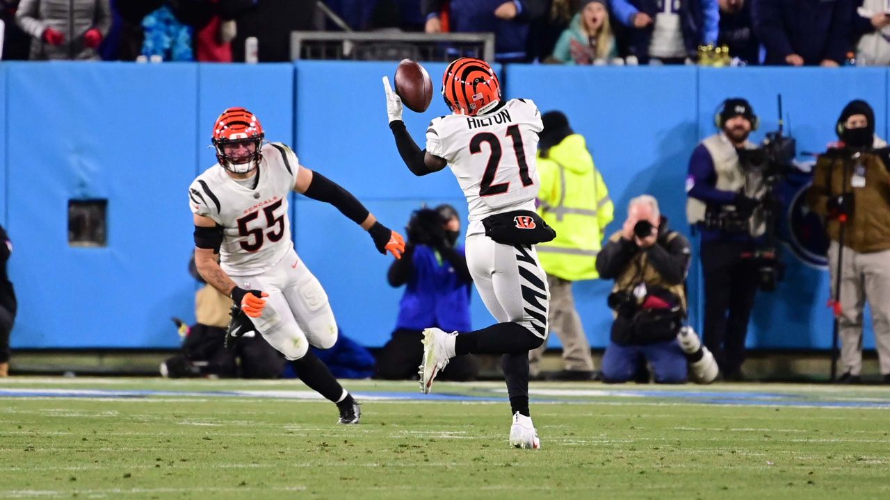 Las Vegas Raiders' Zay Jones (7) is tackled by Cincinnati Bengals' Chidobe  Awuzie (22) during the first half of an NFL wild-card playoff football  game, Saturday, Jan. 15, 2022, in Cincinnati. (AP