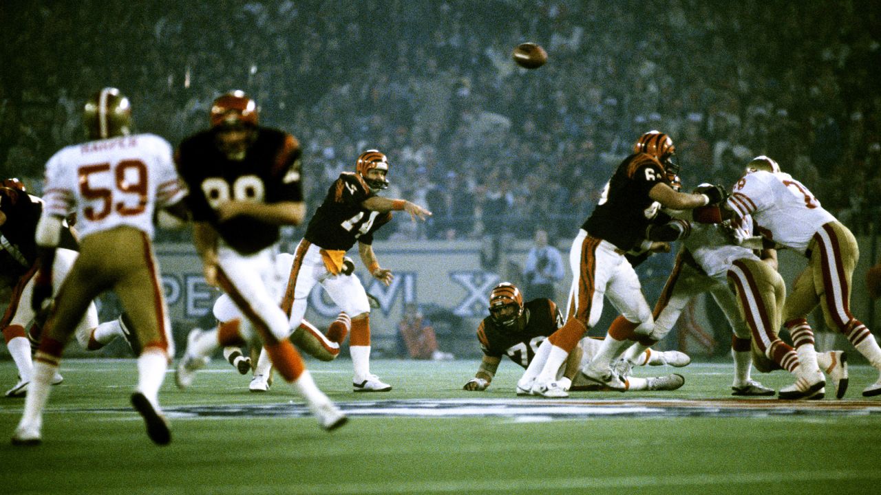 Cincinnati Bengals quarterback Ken Anderson (14) smiles as he congratulates  Cleveland Browns' quarterback Brian Sipe (17)