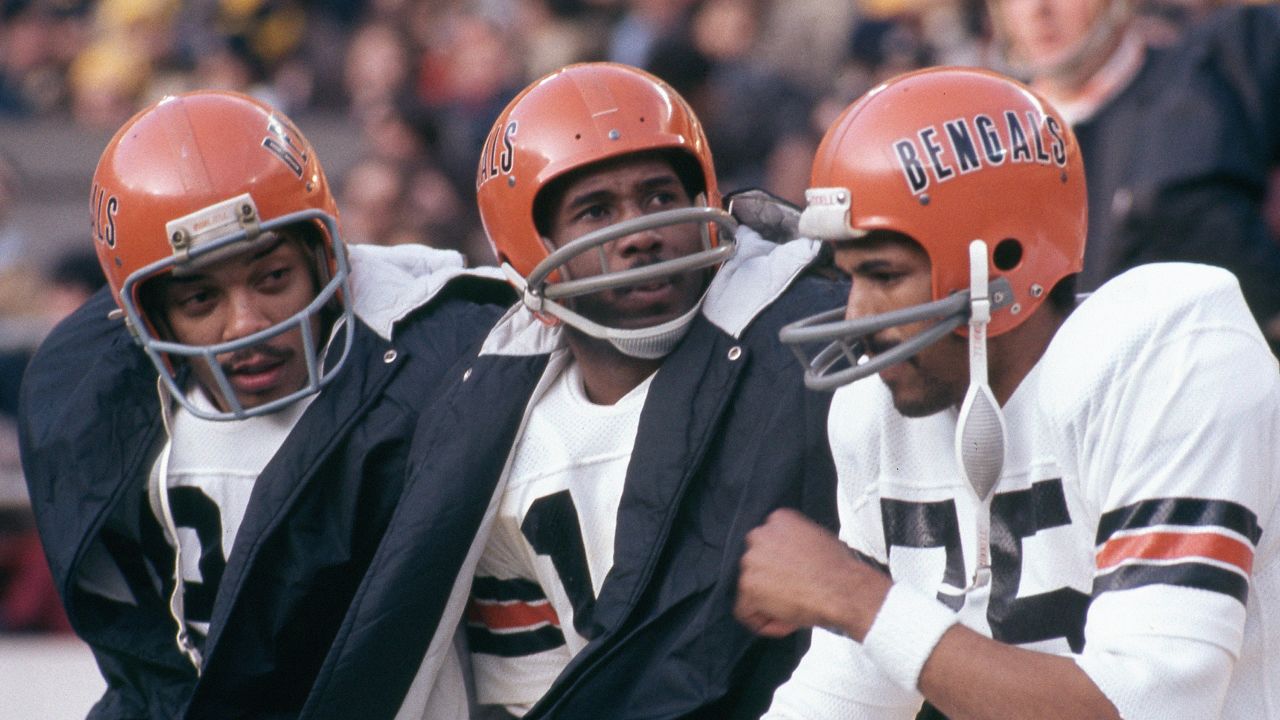 Washington Redskins full back John Riggins (44) runs over Cincinnatti  Bengal linebacker Jim LeClair (55) during