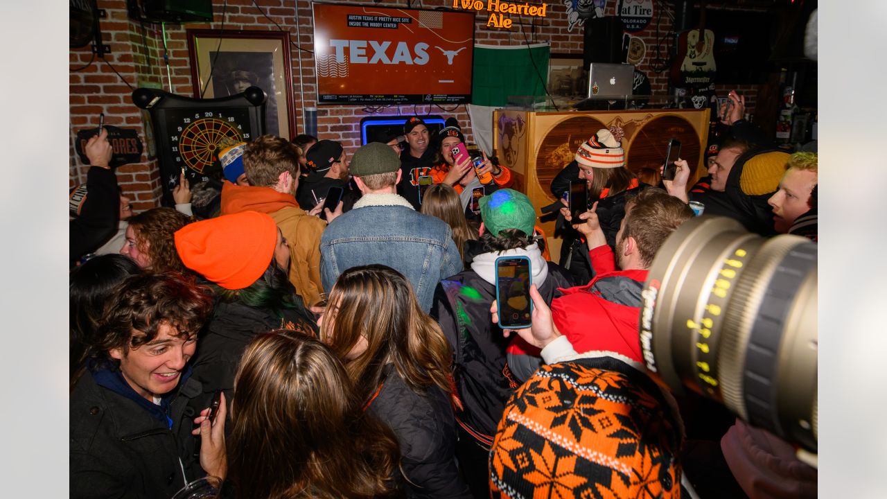 Bengals head coach presents game ball to local bars