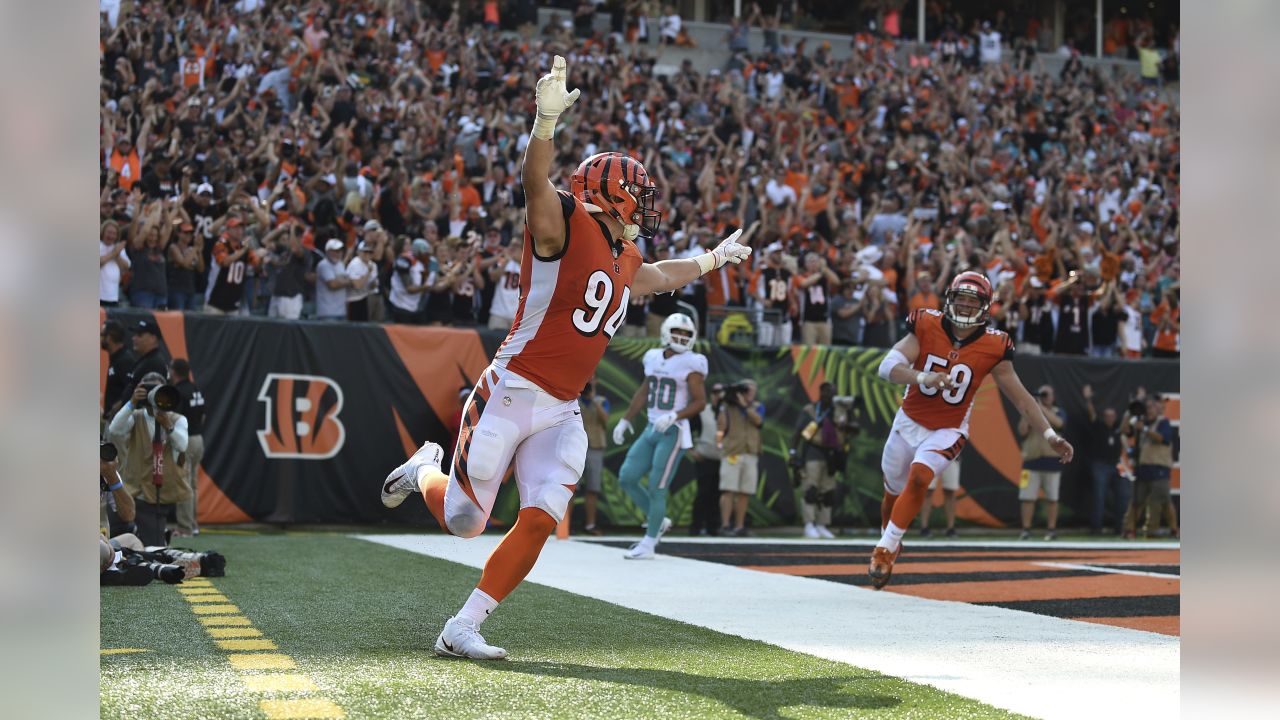 Cincinnati Bengals defensive end Sam Hubbard (94) celebrates a touchdown on  a fumble return against the Miami Dolphins during the second half of an NFL  football game in Cincinnati, Sunday, Oct. 7, …