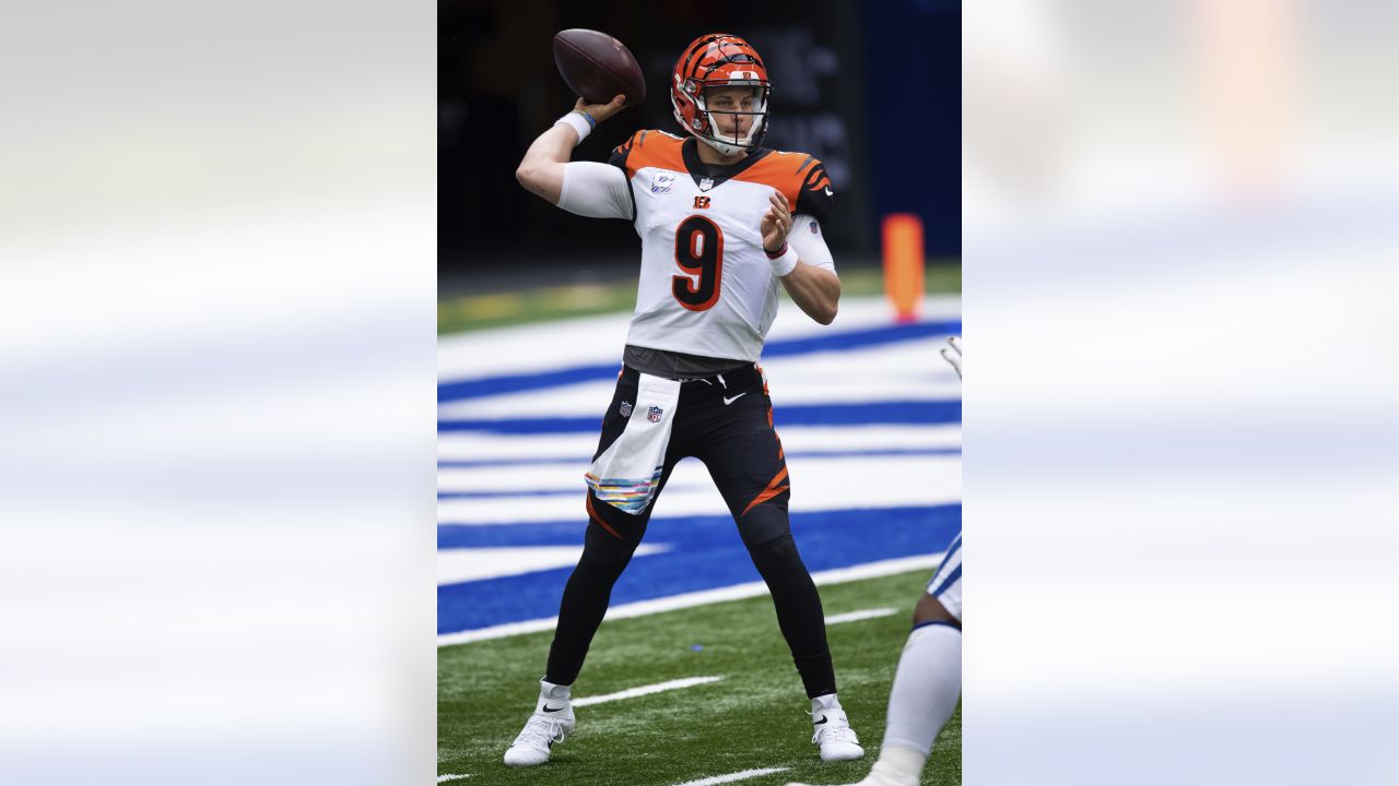 Cincinnati Bengals quarterback Joe Burrow (9) walks to the sidelines during  an NFL football gam …