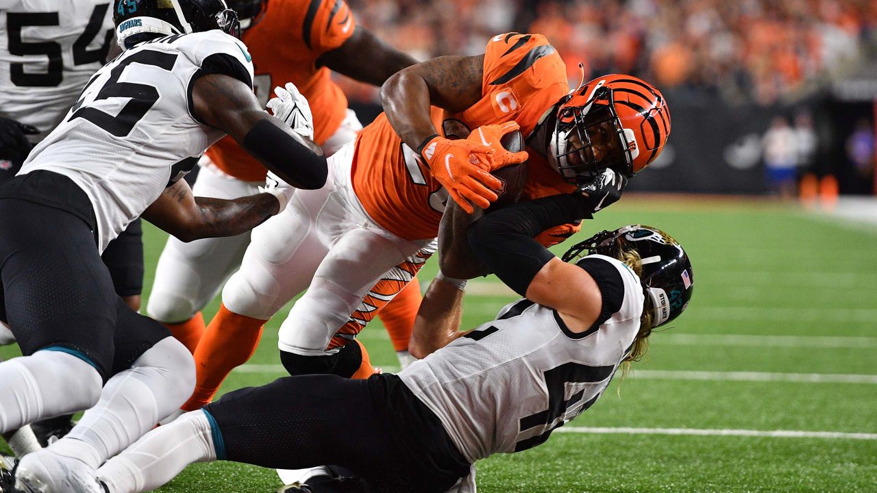 Jacksonville Jaguars' James Robinson (25) is tackled by Cincinnati Bengals'  Vonn Bell (24) during the first half of an NFL football game, Thursday,  Sept. 30, 2021, in Cincinnati. (AP Photo/Michael Conroy Stock Photo - Alamy