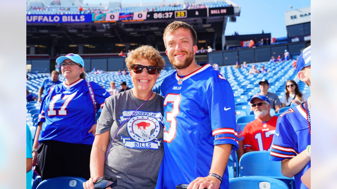 Buffalo Bills vs. Miami Dolphins. Fans support on NFL Game. Silhouette of  supporters, big screen with two rivals in background Stock Photo - Alamy