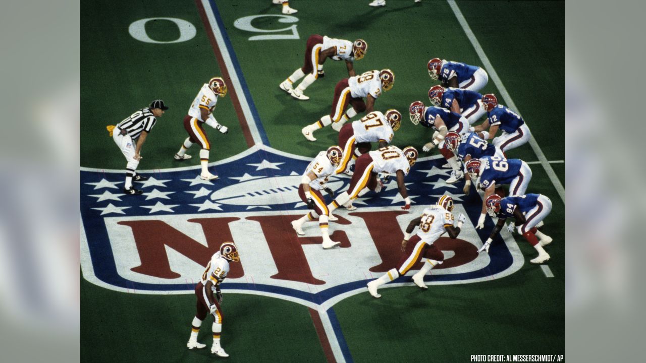 Buffalo Bills quarterback Jim Kelly (12) looks for an open receiver first  quarter action against the Dallas Cowboys at Super Bowl XXVIII in the  Georgia Dome, Sunday, Jan. 30, 1994. The Cowboys