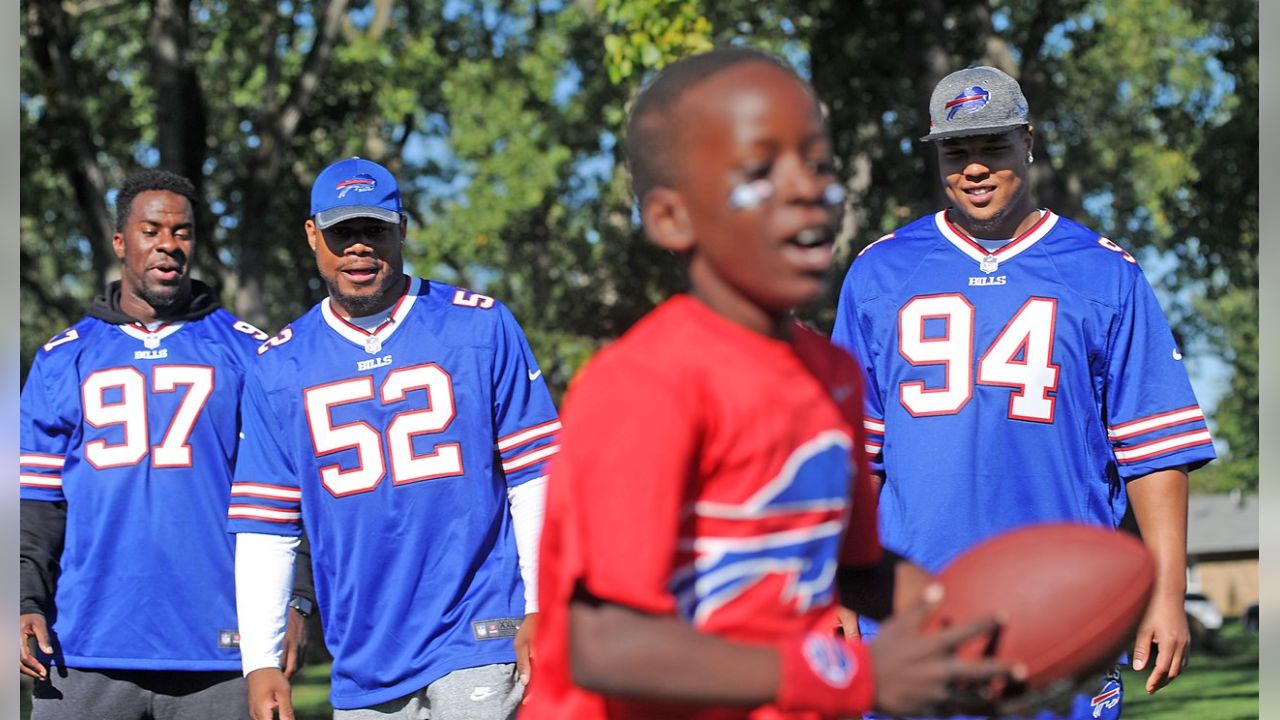 Julia Crossley delivers game ball to referee Carl Cheffers as part of NFL  PLAY 60