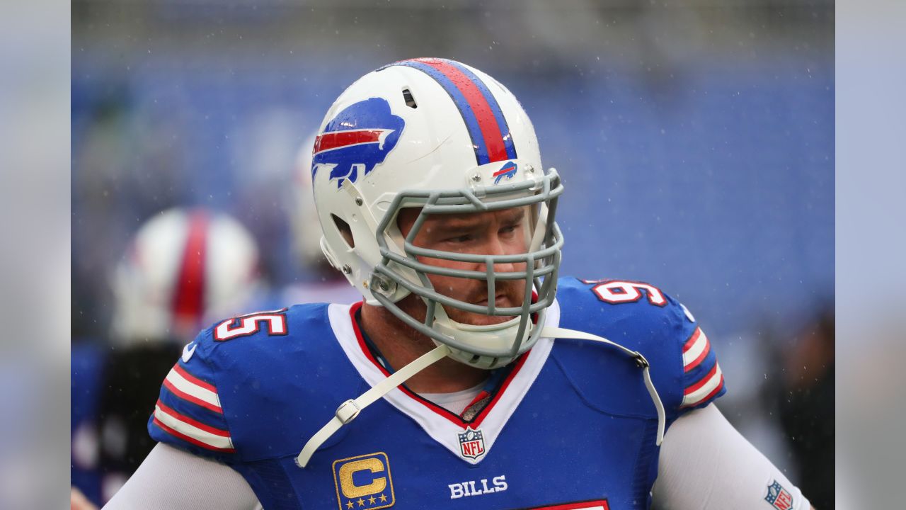 Buffalo Bills defensive tackle Kyle Williams (95) and a group of players  fall to the ground in celebration after Williams scored a touchdown, during  the second half of an NFL football game